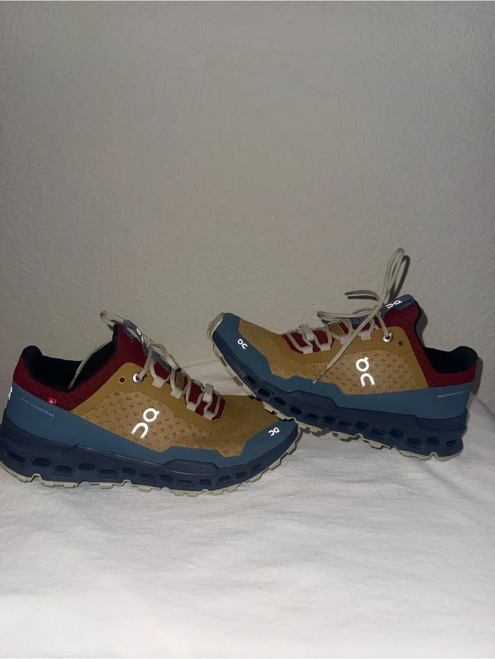 On Running women’s Trail Shoes in Brown, Blue & Maroon